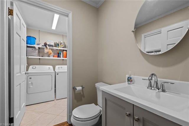 1732 Edgewood Ave, Burlington, NC 27215 - half bath with washing machine and dryer, vanity, crown molding, and tile patterned flooring