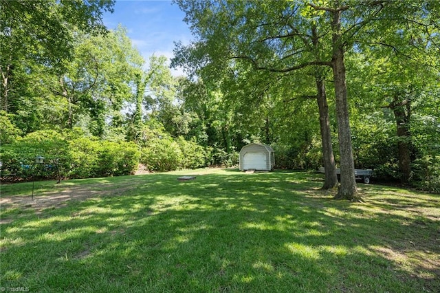 1732 Edgewood Ave, Burlington, NC 27215 - view of green lawn featuring a shed and a detached garage