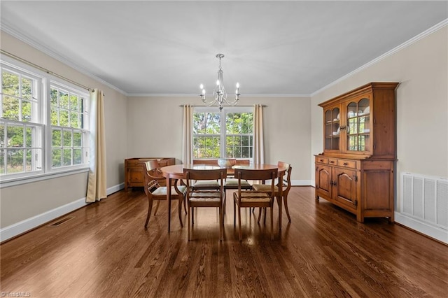 1732 Edgewood Ave, Burlington, NC 27215 - dining space with a chandelier, dark wood-style floors, plenty of natural light, and ornamental molding
