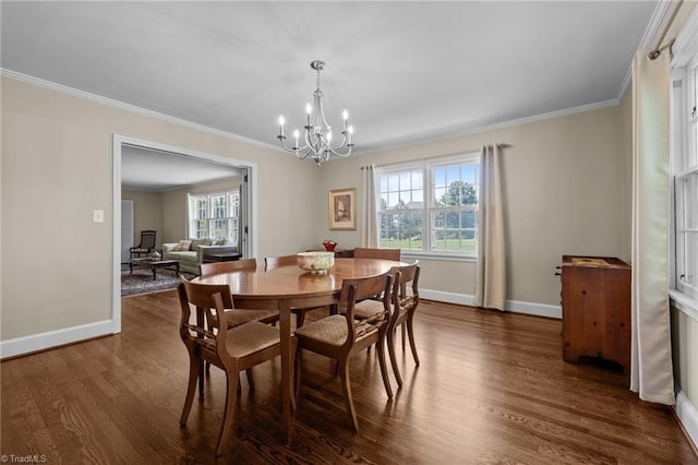 1732 Edgewood Ave, Burlington, NC 27215 - dining room featuring plenty of natural light, a chandelier, ornamental molding, and dark wood finished floors