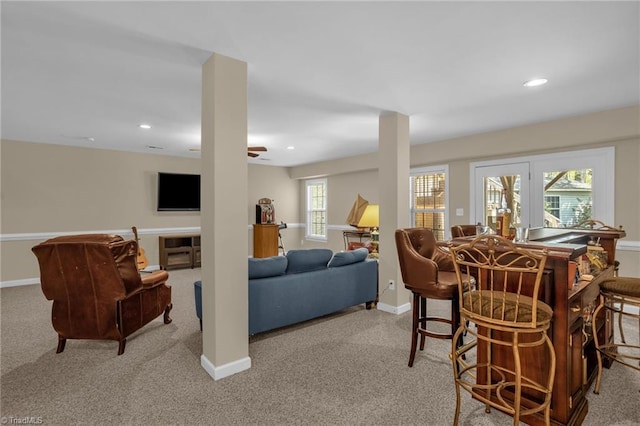 dining space featuring light colored carpet, recessed lighting, a ceiling fan, and baseboards