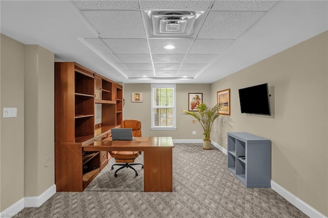 office space featuring recessed lighting, a drop ceiling, carpet floors, and baseboards