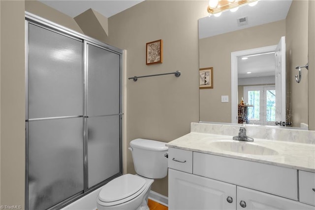 full bathroom with visible vents, toilet, a shower with door, and vanity