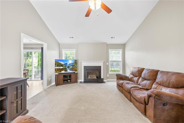 5803 Sycamore Glen Rd, Greensboro, NC 27405 - living area featuring lofted ceiling, ceiling fan, light carpet, and plenty of natural light