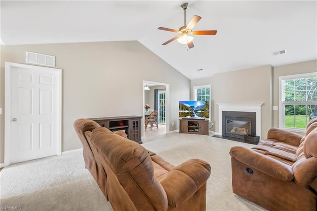 5803 Sycamore Glen Rd, Greensboro, NC 27405 - living room featuring light carpet, a fireplace with flush hearth, ceiling fan, and high vaulted ceiling
