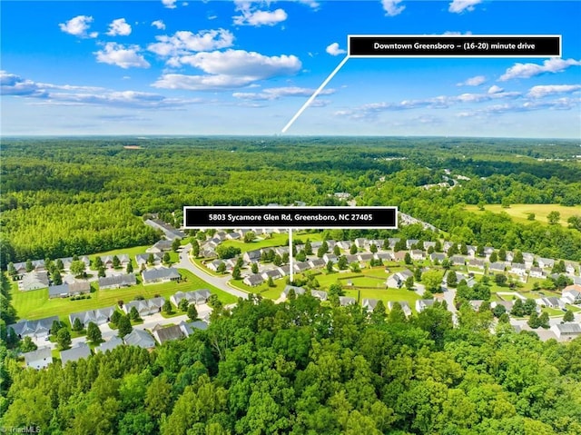 5803 Sycamore Glen Rd, Greensboro, NC 27405 - aerial perspective of suburban area with a heavily wooded area