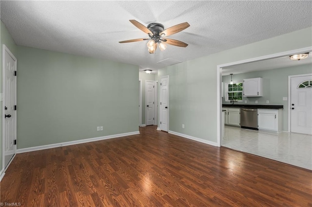 1650 Billy Dr, Winston-Salem, NC 27107 - unfurnished room with a ceiling fan, wood finished floors, and a textured ceiling