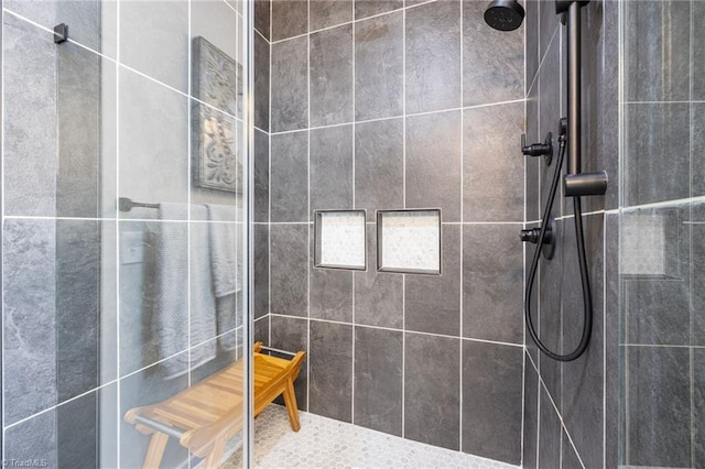 bathroom with tiled shower