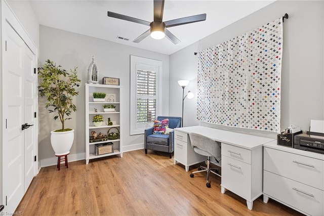 office space featuring ceiling fan and light wood-type flooring