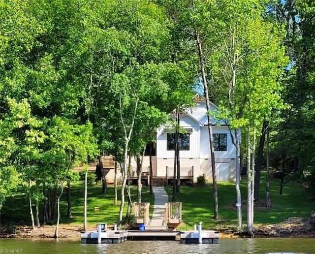 back of house featuring a water view