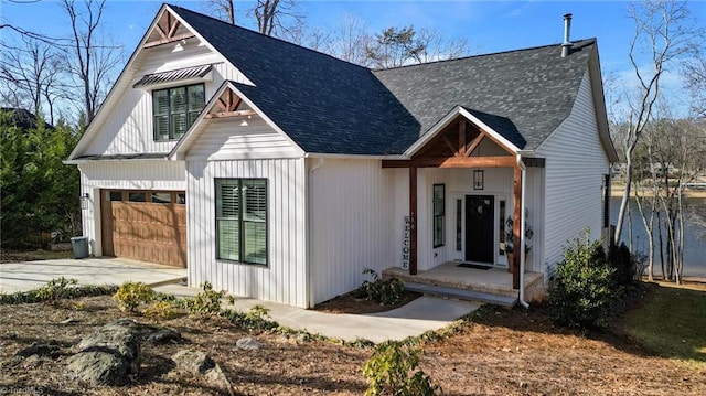 modern farmhouse with a garage and covered porch