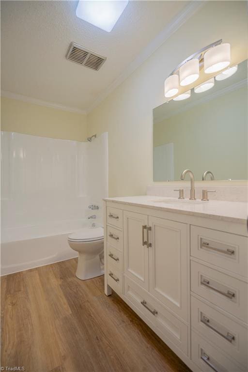 804 W 4th Ave, Lexington, NC 27292 - bathroom with tub / shower combination, visible vents, crown molding, toilet, and wood finished floors