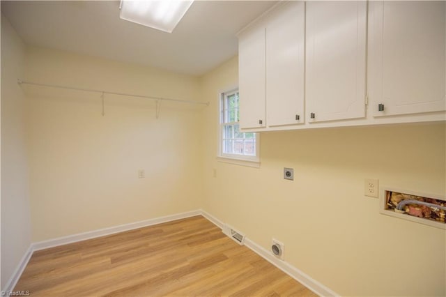 804 W 4th Ave, Lexington, NC 27292 - laundry room with washer hookup, electric dryer hookup, baseboards, light wood-style floors, and cabinet space