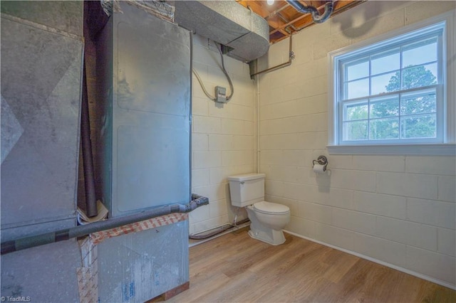 804 W 4th Ave, Lexington, NC 27292 - full bath with concrete block wall, wood finished floors, toilet, and walk in shower