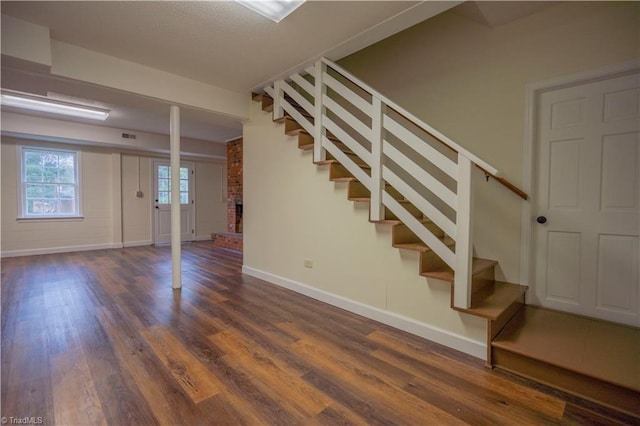 804 W 4th Ave, Lexington, NC 27292 - basement with stairway, baseboards, visible vents, a fireplace, and wood finished floors