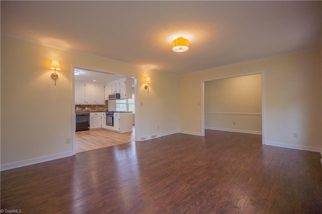 804 W 4th Ave, Lexington, NC 27292 - unfurnished living room with visible vents, baseboards, and wood finished floors
