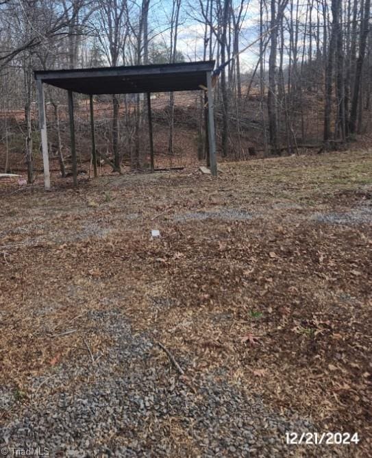 view of yard with a carport