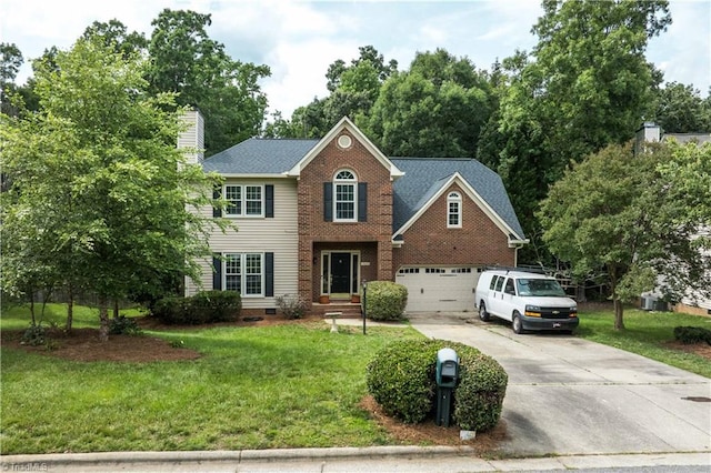 1923 Treyburn Ln, High Point, NC 27265 - view of front facade featuring concrete driveway, a front lawn, a chimney, and an attached garage