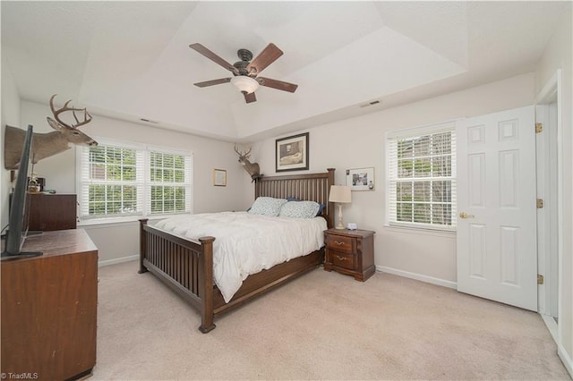 1923 Treyburn Ln, High Point, NC 27265 - bedroom featuring light colored carpet, a tray ceiling, and a ceiling fan