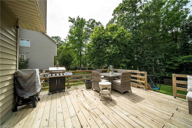 1923 Treyburn Ln, High Point, NC 27265 - wooden deck featuring outdoor dining space, view of wooded area, and a grill