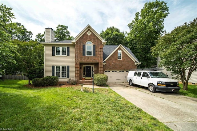 1923 Treyburn Ln, High Point, NC 27265 - view of front of house with driveway, a chimney, a garage, and brick siding