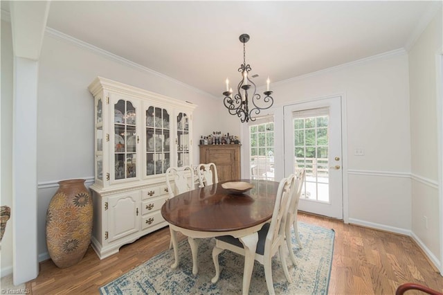 1923 Treyburn Ln, High Point, NC 27265 - dining space with a chandelier, crown molding, and light wood-style floors