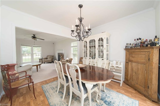 1923 Treyburn Ln, High Point, NC 27265 - dining room with plenty of natural light, ornamental molding, a chandelier, light wood finished floors, and ceiling fan