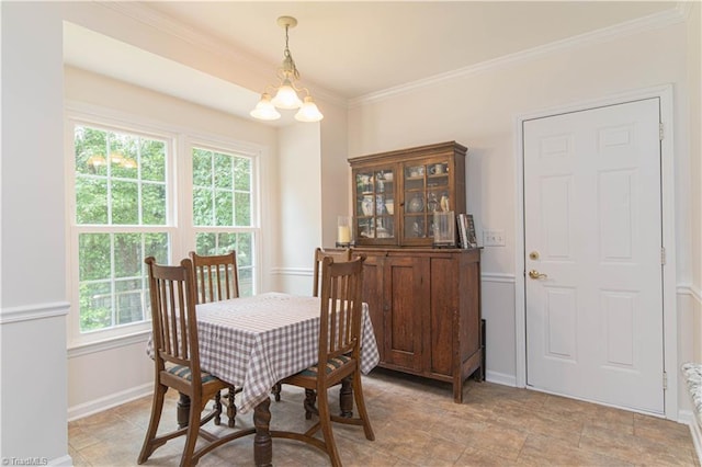 1923 Treyburn Ln, High Point, NC 27265 - dining room featuring crown molding, a chandelier, and stone finish flooring