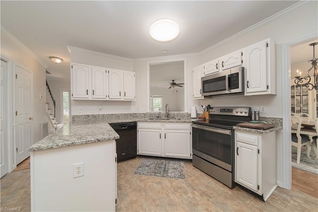 1923 Treyburn Ln, High Point, NC 27265 - kitchen with appliances with stainless steel finishes, white cabinets, ornamental molding, a ceiling fan, and a peninsula