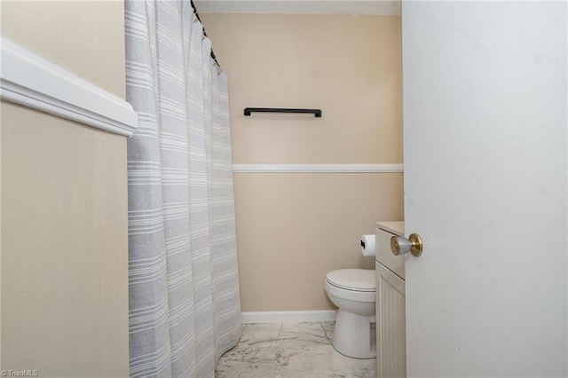 full bath with toilet, marble finish flooring, baseboards, and a shower with shower curtain
