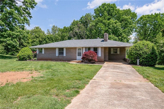 single story home featuring concrete driveway, a chimney, a front lawn, and a carport
