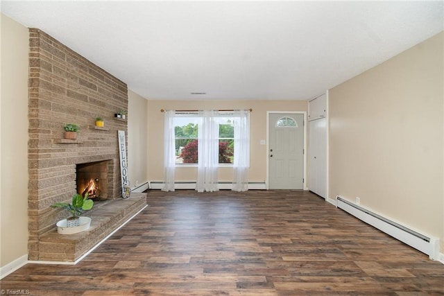 unfurnished living room with baseboard heating, wood finished floors, a baseboard radiator, and a fireplace