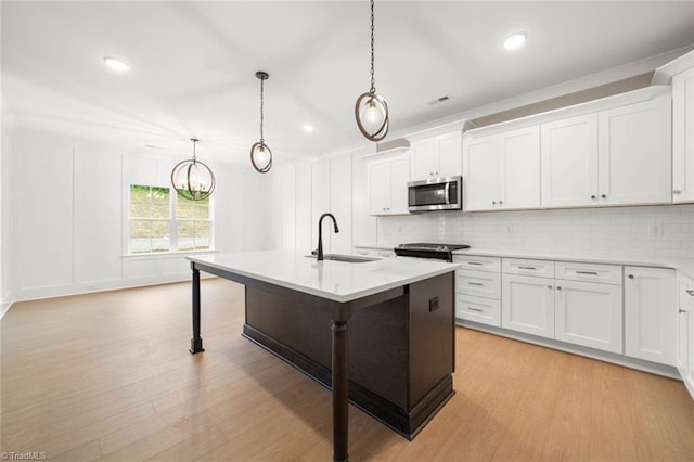 6957 Orchard Path Dr, Clemmons, NC 27012 - kitchen with stainless steel appliances, a sink, light countertops, backsplash, and recessed lighting