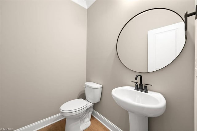 6957 Orchard Path Dr, Clemmons, NC 27012 - bathroom featuring baseboards, wood finished floors, and toilet