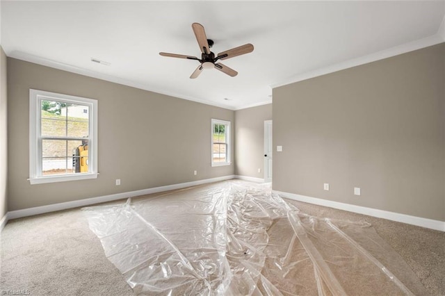 6957 Orchard Path Dr, Clemmons, NC 27012 - unfurnished room with crown molding, healthy amount of natural light, ceiling fan, light colored carpet, and baseboards