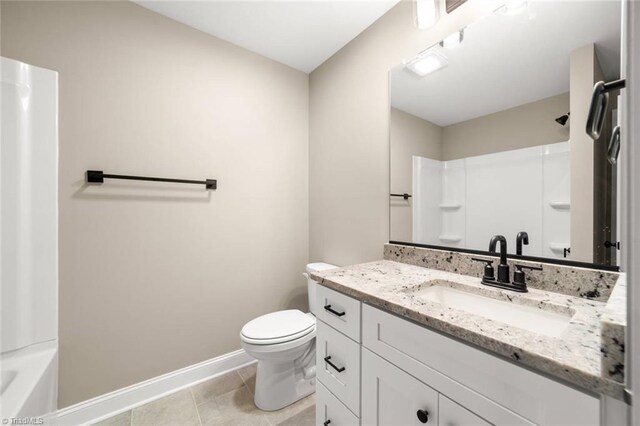 6957 Orchard Path Dr, Clemmons, NC 27012 - full bath with baseboards, vanity, toilet, and tile patterned flooring