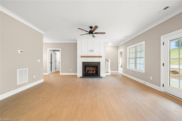 6957 Orchard Path Dr, Clemmons, NC 27012 - unfurnished living room with light wood finished floors, crown molding, baseboards, ceiling fan, and a large fireplace
