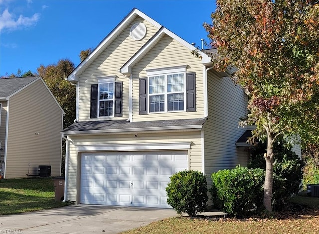 view of front of property with a garage and central air condition unit