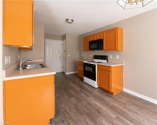 kitchen with dark wood-type flooring, white range with electric stovetop, and sink