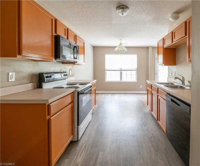 kitchen with sink, a textured ceiling, white range oven, dark wood-type flooring, and dishwasher