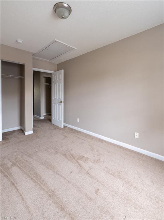 unfurnished bedroom with light carpet