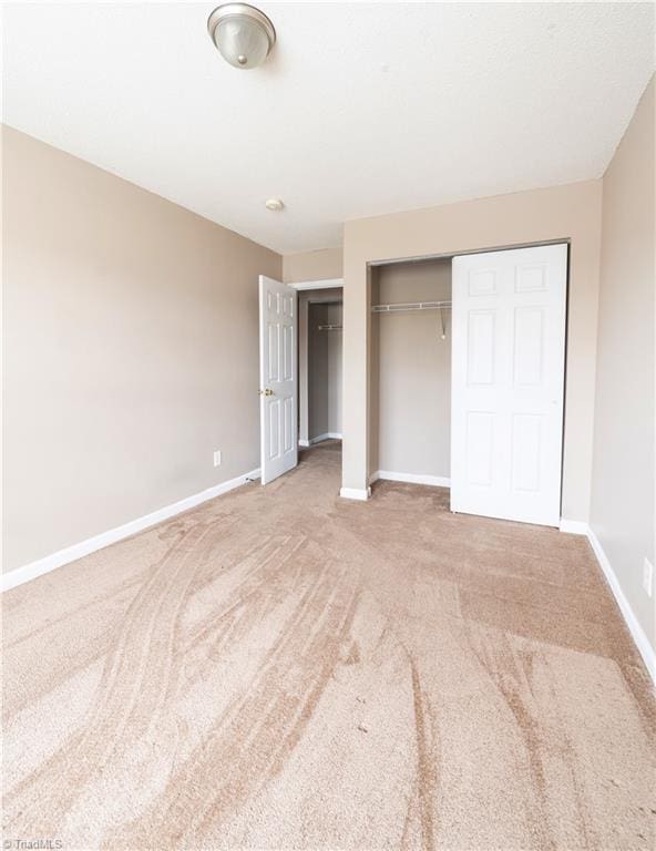 unfurnished bedroom featuring carpet flooring