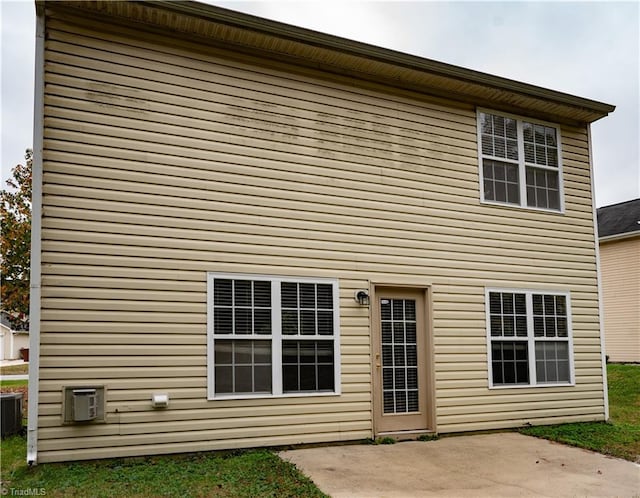 back of house featuring central AC and a patio area