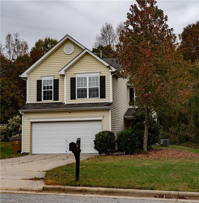 view of front of property featuring central AC unit and a garage