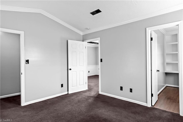 170 Vista Cir Unit C, Winston-Salem, NC 27106 - unfurnished bedroom with crown molding, dark carpet, lofted ceiling, baseboards, and a walk in closet