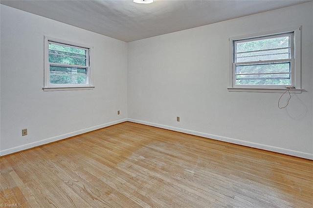 unfurnished room featuring light hardwood / wood-style flooring