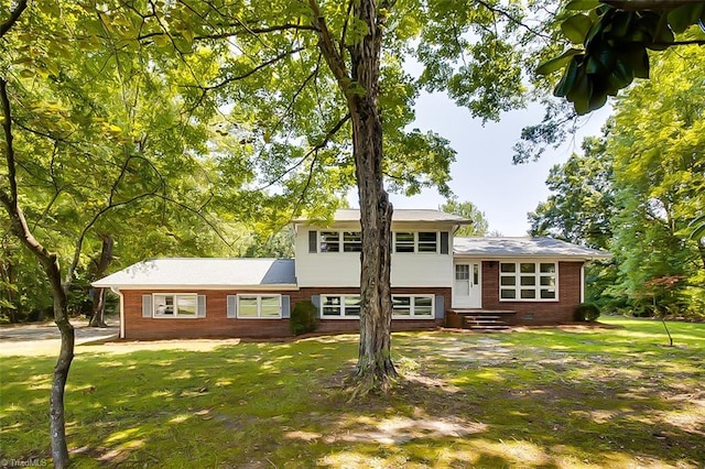 split level home with a front yard