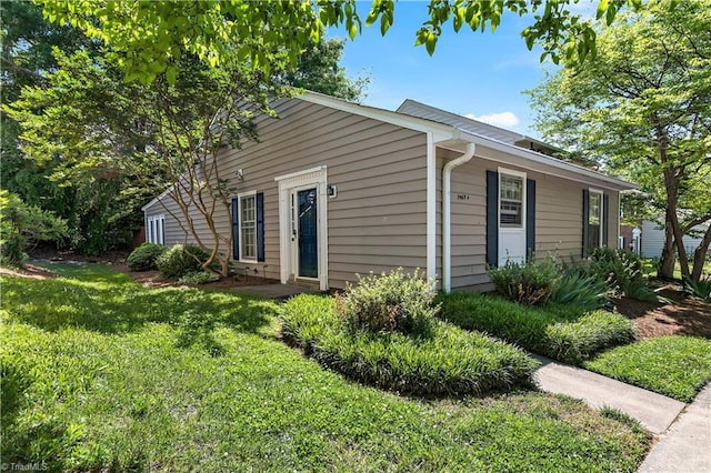 view of home's exterior featuring a yard