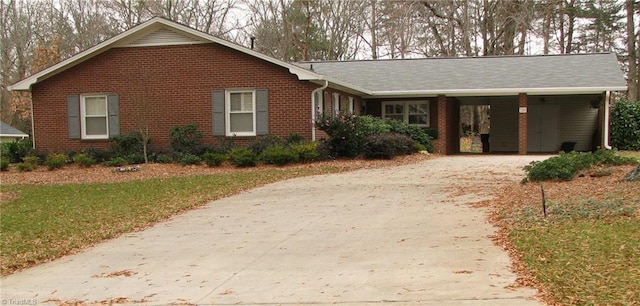 740 Archer Rd, Winston-Salem, NC 27106 - single story home with concrete driveway, brick siding, a front lawn, and a carport