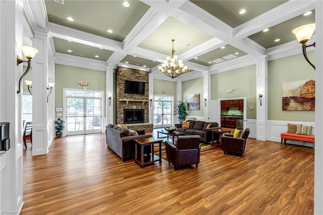 living room featuring a wealth of natural light, a high ceiling, and beamed ceiling